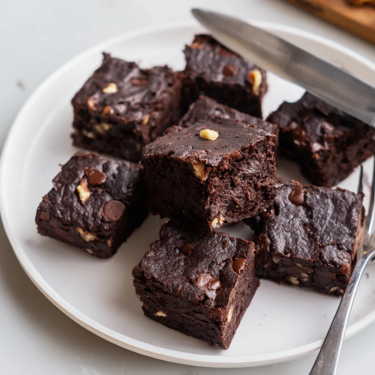 Deliciously fudgy Zero-Waste Brownies topped with nuts, perfect for dessert lovers.  