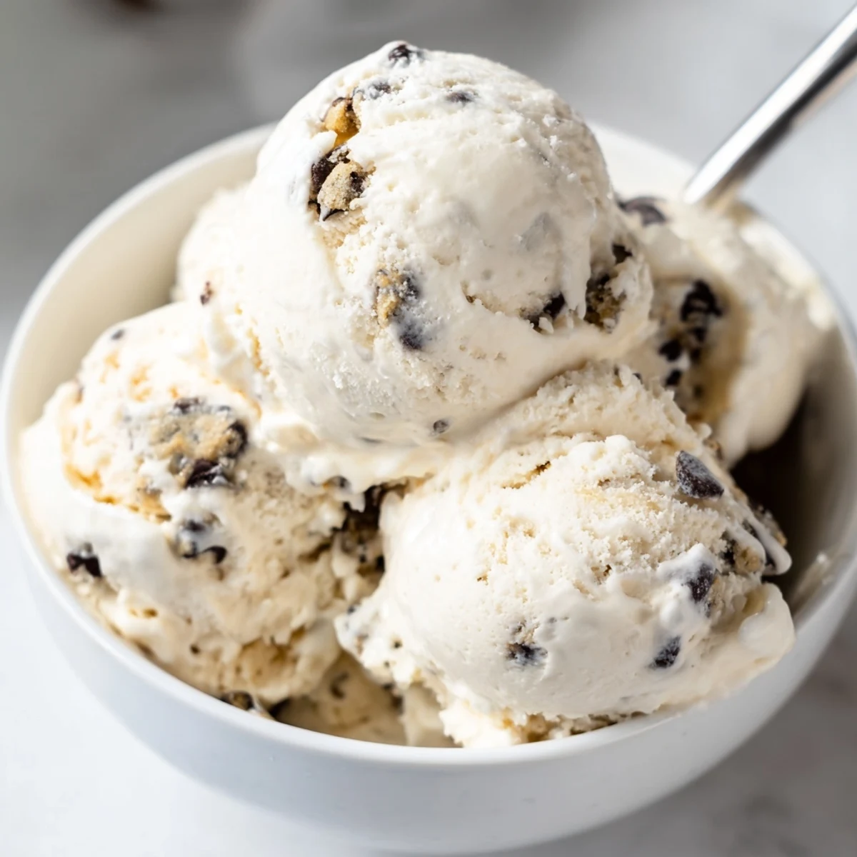 Homemade cottage cheese ice cream topped with chunks of delicious edible cookie dough.  