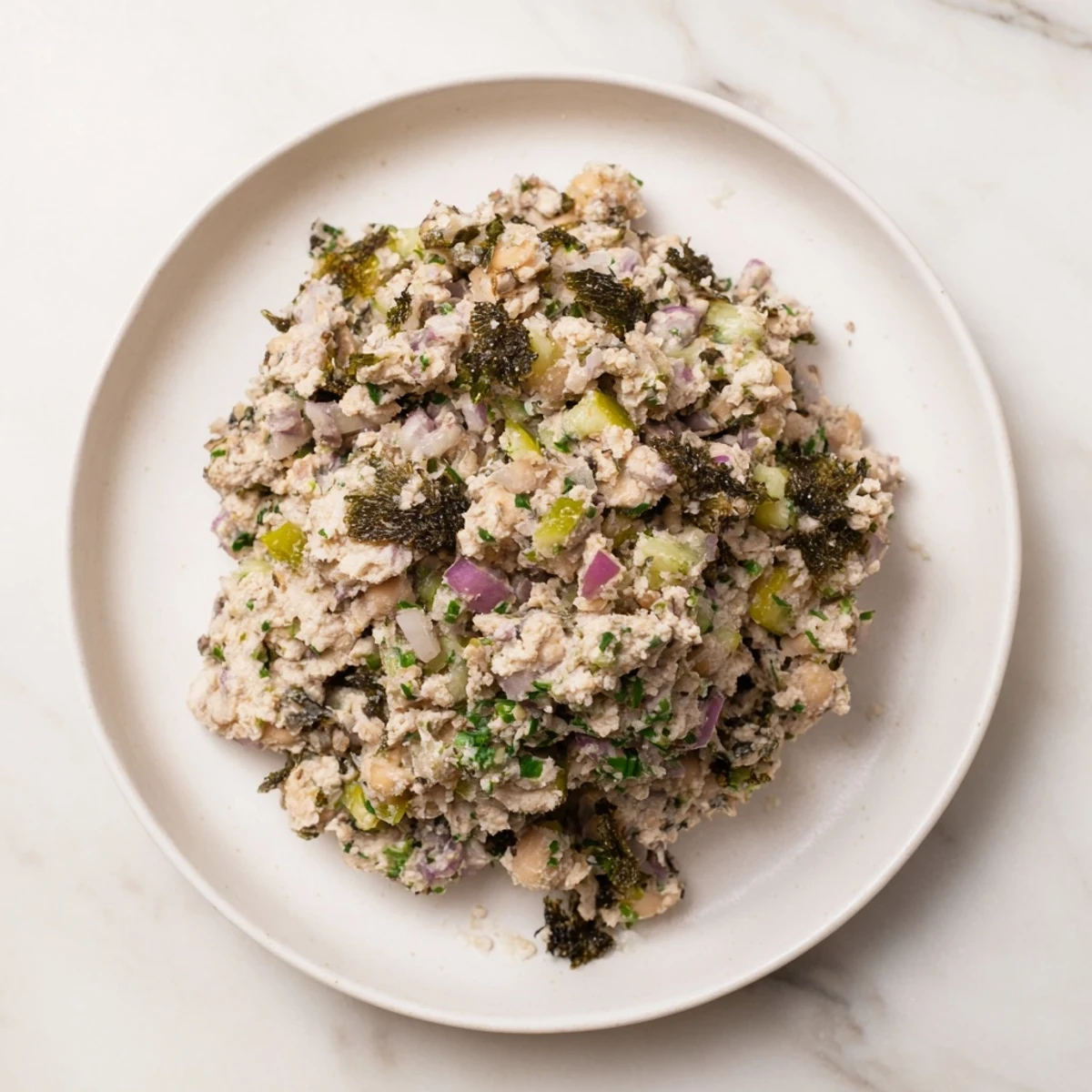 Creamy chickpea tuna salad, a delightful vegan alternative, served on toasted whole-wheat bread.