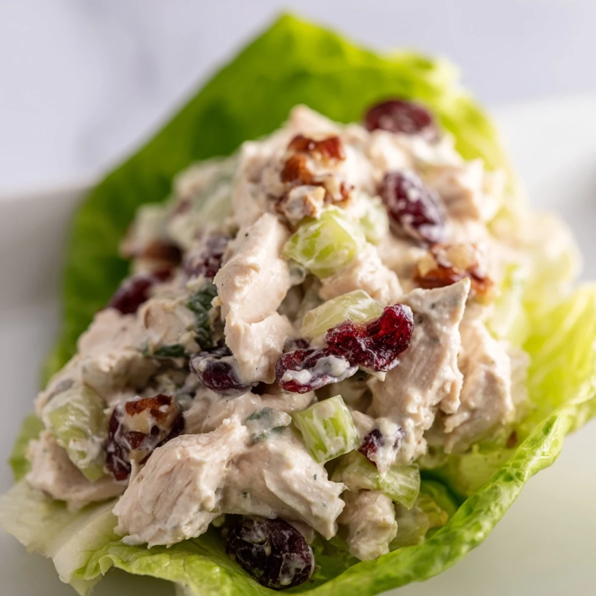 Fresh and colorful Simplified Festive Chicken Salad Cups, served in crisp lettuce, bursting with juicy grapes.