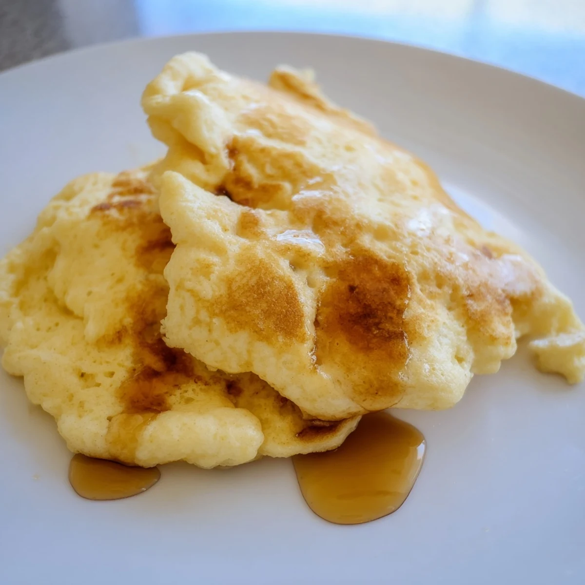Golden, fluffy scrambled pancakes, a quick American breakfast served hot from the skillet.