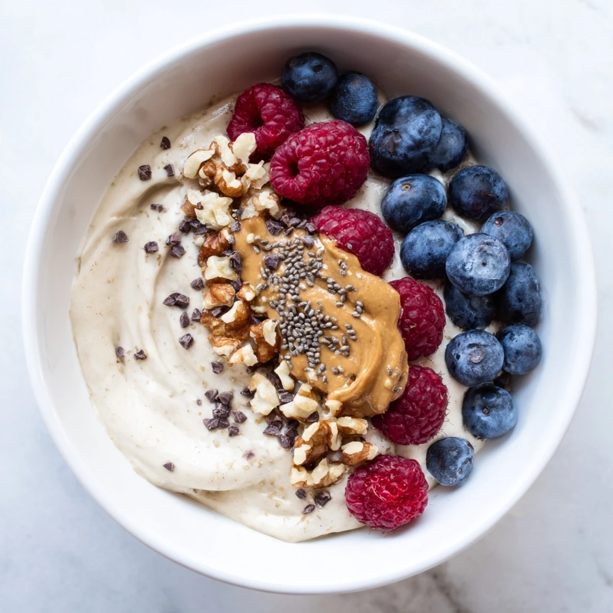 Delicious, refreshing Protein Ice Cream Bowl, perfect for a post-workout treat, topped with chocolate chips.