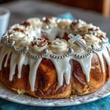 Beautiful First Communion Cake adorned with handcrafted white roses and a cross topper, perfect for celebrating this special religious milestone.
