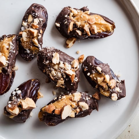 A close-up of Date Bark Snickers-Style shows a sweet treat, drizzled with melted chocolate and peanuts.