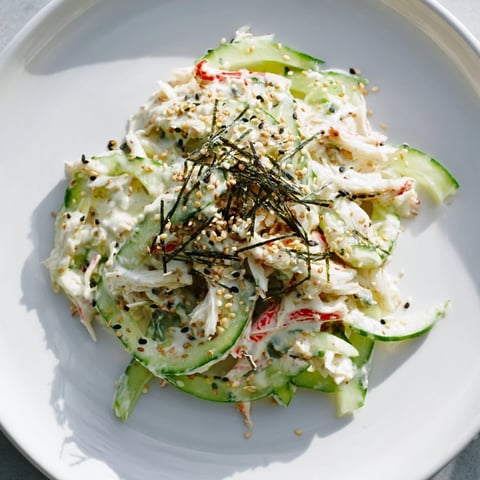 California Roll Cucumber Salad featuring fresh cucumbers, seasoned crab, and sesame seeds; a beautiful, refreshing dish.