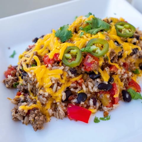 A bubbling casserole with Tex-Mex Beef & Rice, showcasing a vibrant medley of flavors and ingredients.