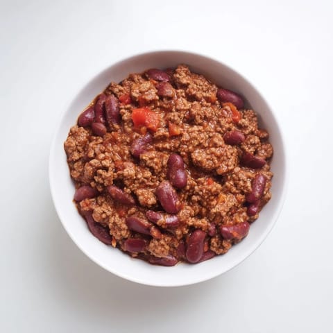 Hearty 4-Ingredient slow cooker chili bubbling in the pot, offering delicious aromas for an easy dinner.