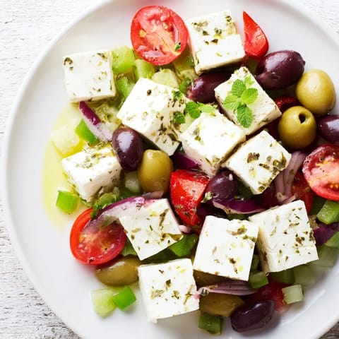 This tempting Mediterranean Mezza Platter shows hummus, pita, and olives artfully arranged for a feast.