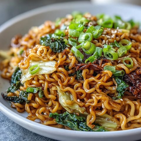 Quick stir-fried Fried Cabbage Ramen plated fresh with scallions and sesame for a weeknight meal.