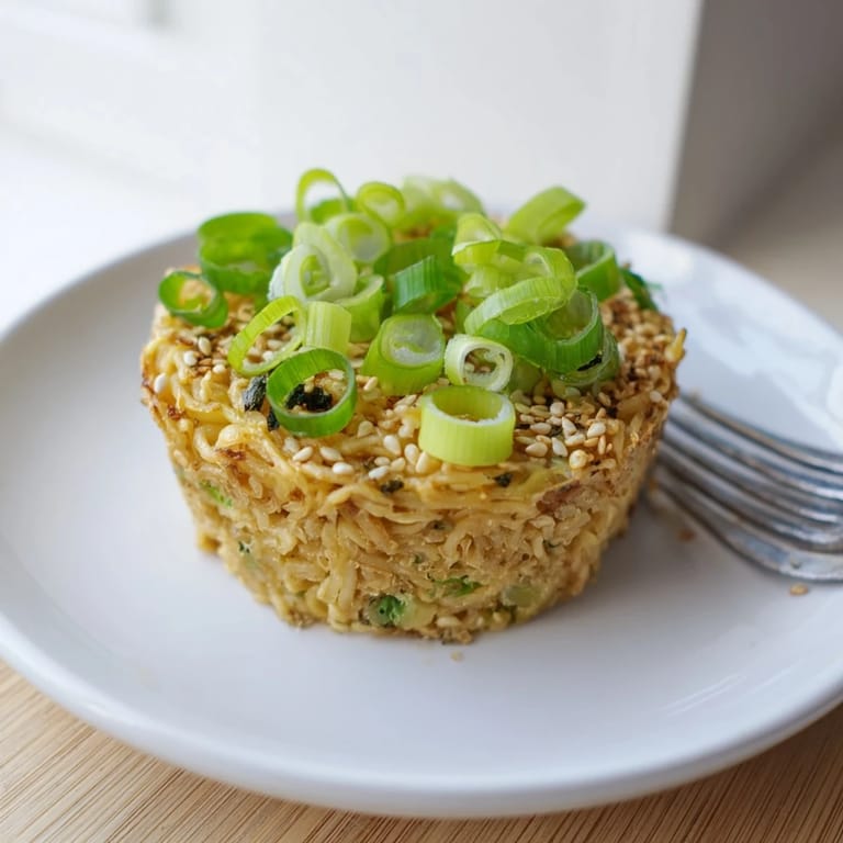 Savory muffins featuring soft-boiled ramen eggs nestled in umami-rich batter.  