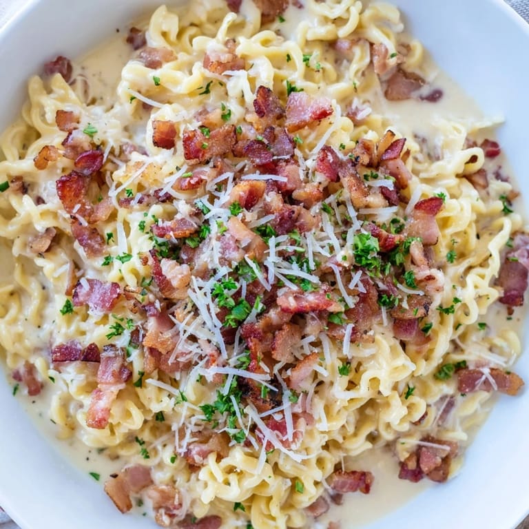 Perfectly cooked Instant Pot carbonara ramen hack, with fresh parsley garnish adding a bright touch.