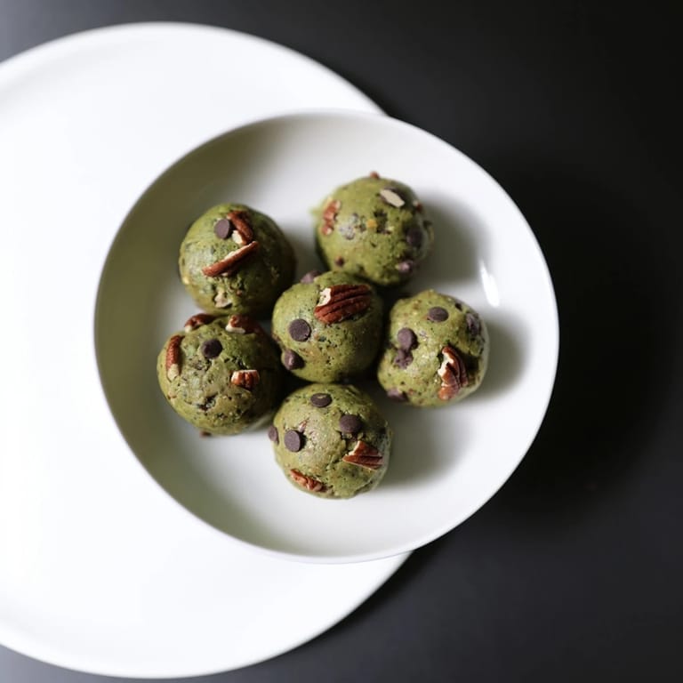 These homemade Matcha Gingerbread Cookie Dough Protein Bites, full of flavor, are a delicious post-workout recovery treat.