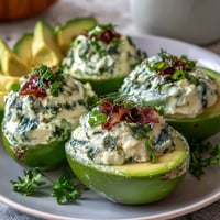 Green avocado deviled eggs with fresh herbs, a creamy spring appetizer perfect for parties.  